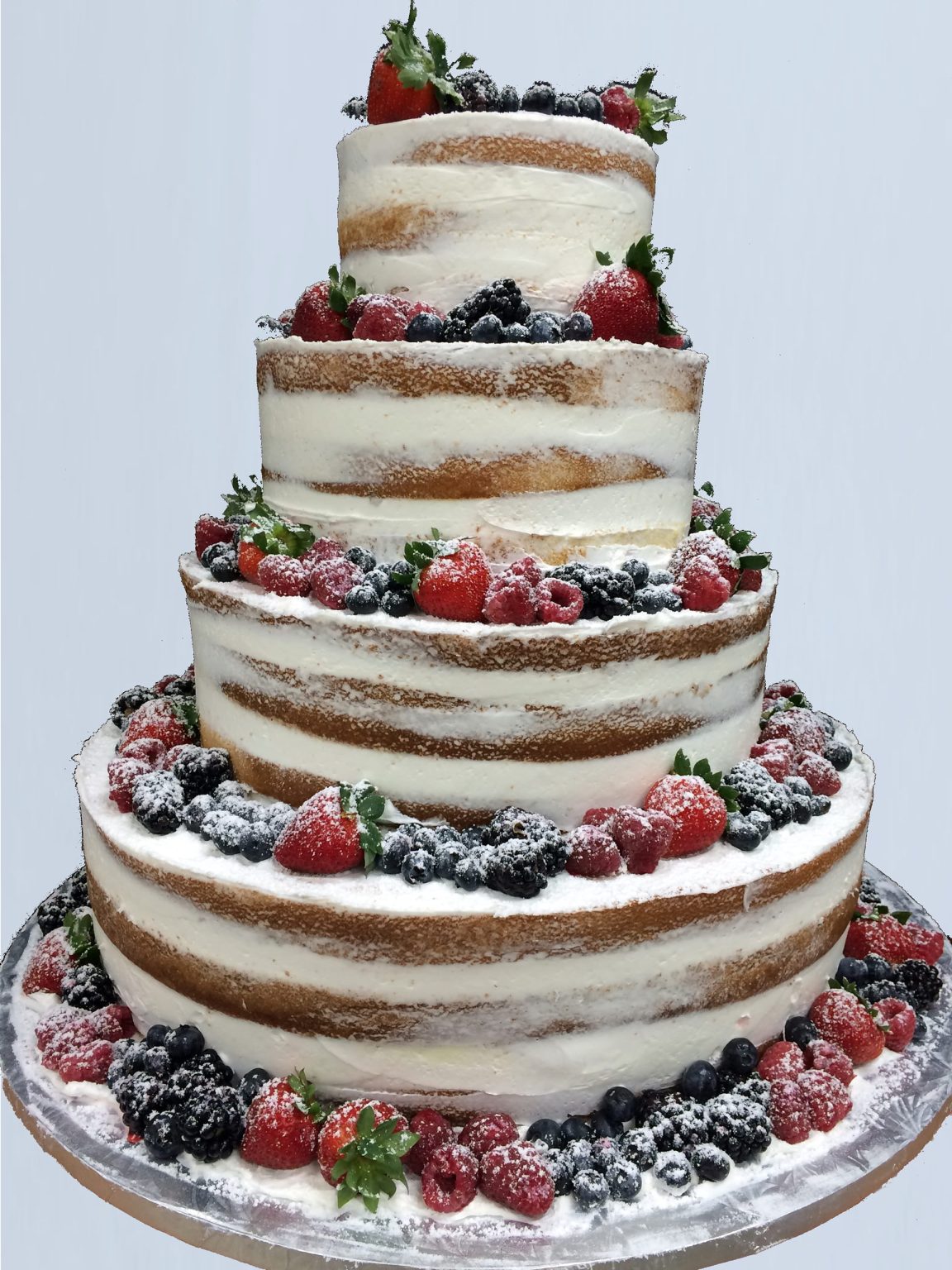 Photo: Off white cake with different kind of berries